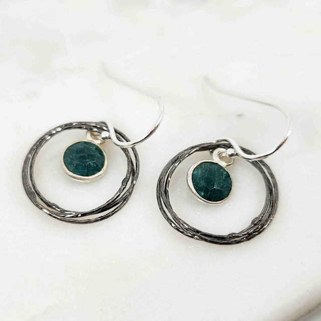 Round Emerald Surrounded by Sparkling Intertwined Wire Circle Earrings