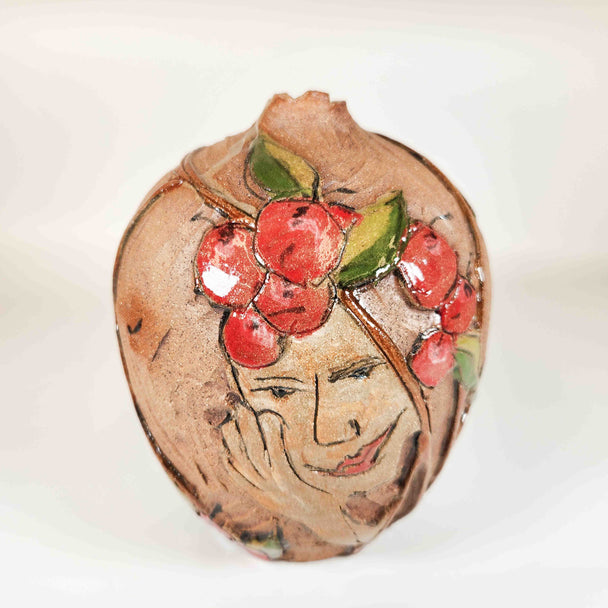 Carved Cherry Face Bottle