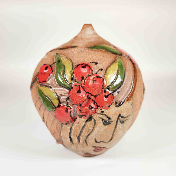 Carved Cherry Face Bottle