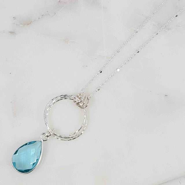 Pear Shaped Blue Topaz Triple Circle Sparkle Drop with Triple Bail Necklace