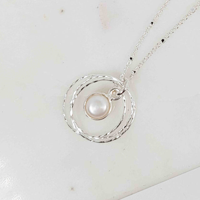 Silver Bezel Wrapped White Pearl Triple Circle Sparkle Necklace