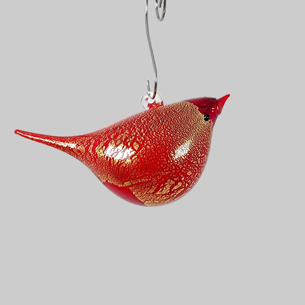 Red glass bird ornament with a white background