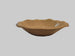 Small ceramic salad bowl with a blurred white background.
