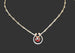 Garnet Horseshoe Sterling Silver Necklace with a black background