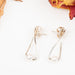 Criss-Cross Earrings With White Pearl